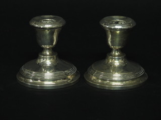 A pair of silver stub shaped candlesticks, Birmingham 1937, 2"