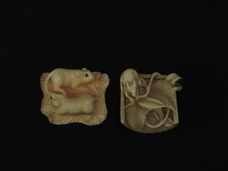 An Oriental carved ivory Netsuke in the form of a carved rat, the  base with seal mark 1" and 1 other carved figure of rats 1"
