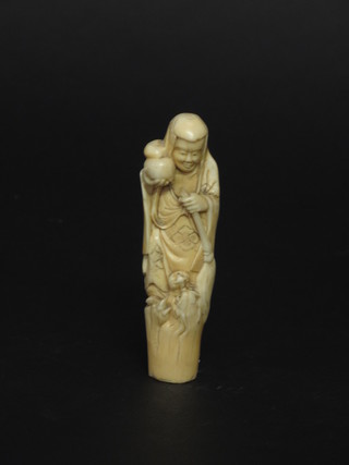 A carved ivory figure of a standing sage 4"
