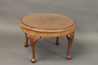 A Queen Anne style figured walnut coffee table raised on cabriole supports 28"