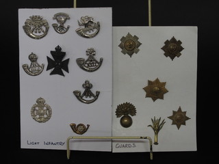 8 cap badges including Irish and Welsh Regts.