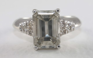 An 18ct white gold dress ring set a rectangular cut diamond,  approx 3.10ct with certificate  ILLUSTRATED