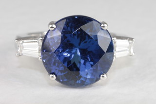 An 18ct white gold dress ring set a large and impressive tanzanite approx. 10.16ct and with diamonds to shoulders approx. 0.63ct