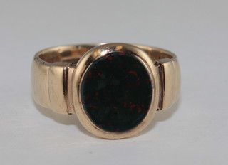 A 9ct gold signet ring set an oval blood stone