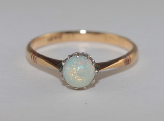 A 15ct gold dress ring set a cabouchon cut opal