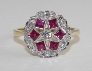 An 18ct yellow gold cluster dress ring set rubies and diamonds