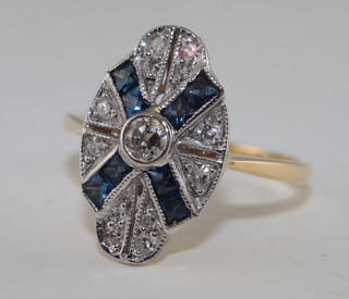An Art Deco style 18ct gold dress ring set sapphires and  diamonds, approx 0.80ct