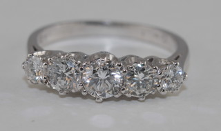 A lady's 18ct white gold dress/engagement ring set 5 round  brilliant cut diamonds, approx 1.35ct