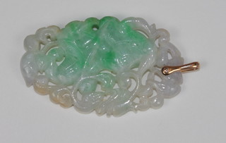A pierced green hardstone pendant