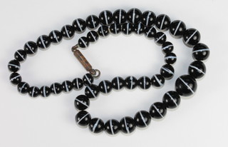 A string of black and white beads