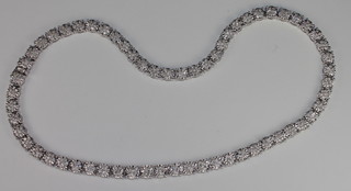 A 9ct white gold necklace set numerous round cut diamonds, approx 8.54ct