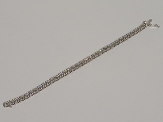 A lady's 14ct white gold bracelet set round cut diamonds, approx  7.54ct