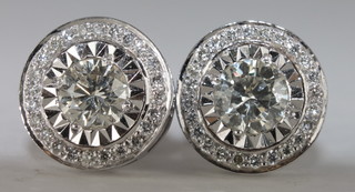 A pair of circular diamond cluster earrings approx 1.20ct