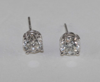 A pair of 14ct white gold diamond set ear studs, approx 1.03ct