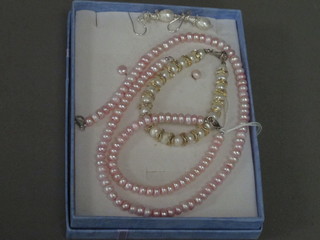 A suite of pink pearl jewellery