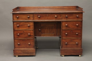 A Victorian mahogany kneehole pedestal wash stand with three-quarter gallery, fitted 1 long drawer above 8 short drawers,  the kneehole fitted a cupboard enclosed by a panelled door 48"