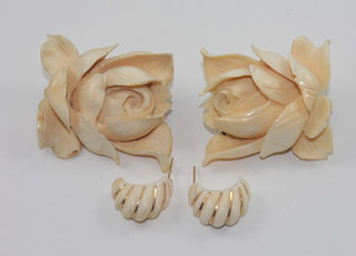 2 carved ivory brooches in the form of flower heads and a pair of carved ivory earrings