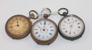 A fob watch contained in a silver case and other fob watches