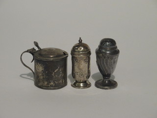 A silver mustard pot together with 2 silver pepperettes