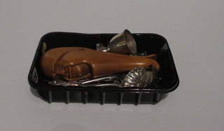 A pair of humerous nut crackers, a silver sifter spoon, silver teaspoon, an Oriental jam spoon and other silver plated flatware