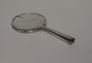 A silver backed hand mirror, mirror cracked,