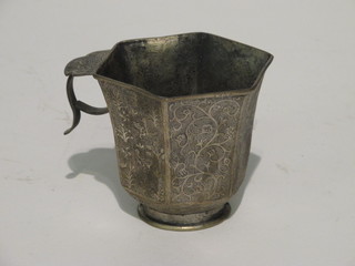 An Eastern engraved white metal mug