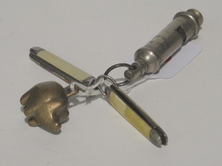 A brass pendant in the form of a pig, 2 folding pocket knives and  an Acme Girl Guide wristwatch