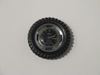A novelty pocket watch made for Dunlop in the form of a tyre