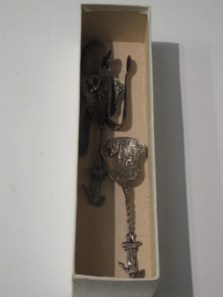A pair of silver sugar tongs, a silver teaspoon with 1953  Coronation mark and 2 white metal spoons