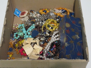 A collection of costume jewellery and a wooden jigsaw puzzle