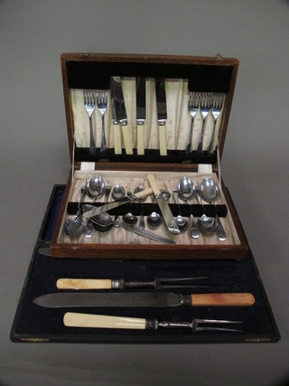 A 3 piece carving set, cased, and a part canteen of cutlery