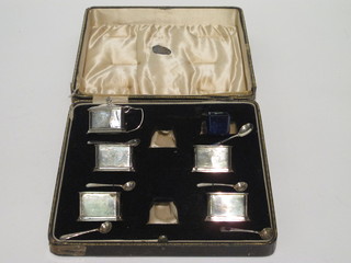 A 5 piece silver cruet comprising 4 salts, mustard pot,  Birmingham 1935, 4 ozs