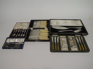 A pair of silver plated fish servers, 6 silver plated fish knives and forks, 6 tea knives and forks, 6 silver plated teaspoons and 6 cake  forks, all cased