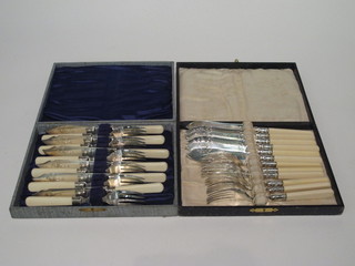 2 sets of 6 silver plated fish knives and forks, cased