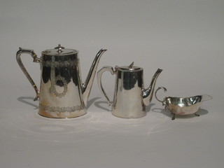 An oval Britannia metal coffee pot, a hotelware coffee pot and a  sauce boat