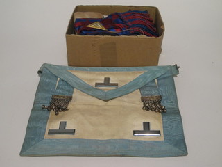 A quantity of Masonic regalia comprising a Master's apron,  Royal Arch Companions apron and sash and various books