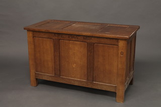 A 20th Century oak coffer of panelled construction marked APB 1965 MDC 38"