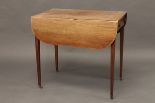 A Georgian mahogany Pembroke table fitted a drawer and raised  on square tapering supports 31"