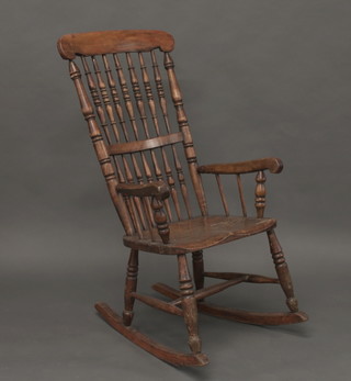 A 19th Century elm spindle back rocking chair