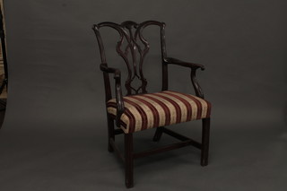 A Georgian mahogany Chippendale style carver chair with  upholstered seat and pierced vase shaped slat back, raised on  square tapering supports  ILLUSTRATED