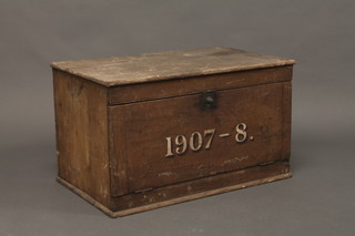An Edwardian pine filing box with fall front, marked 1907-1908, raised on a platform base 30"