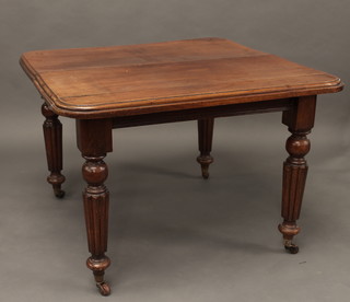A Victorian rectangular mahogany dining table, raised on turned  and reeded supports 41"