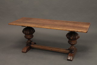 A rectangular refectory style coffee table raised on bulbous turned supports with H framed stretcher 46"