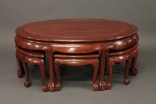 An Oriental oval hardwood nest of 6 interfitting coffee tables 48"