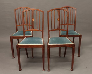 A set of 4 Edwardian inlaid mahogany rail back bedroom chairs with upholstered seats, raised on square tapering supports