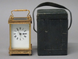 A 19th Century French carriage clock with enamelled dial and Roman numerals contained in a gilt metal case, complete with  leather carrying case  ILLUSTRATED