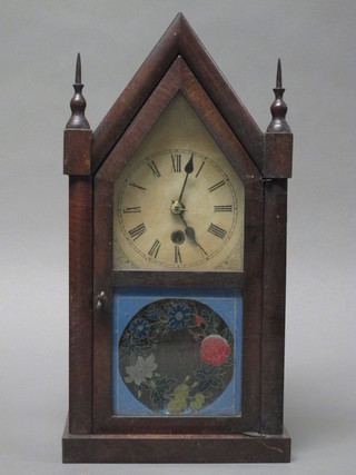 An American 30 hour mantel clock with paper dial and Roman  numerals contained in a walnut case by E N Welch