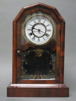 An American striking shelf clock with paper dial and Roman  numerals by the Newhaven Clock Co. contained in a mahogany  finished case