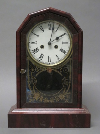 An American striking shelf clock with paper dial and Roman  numerals contained in a mahogany finished case
