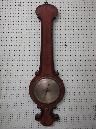 A 19th Century mercury wheel barometer with silvered dial  contained in a wheel case, thermometer missing,